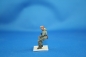 Preview: NW 042 german soldier in winterdress sitting with MP 40